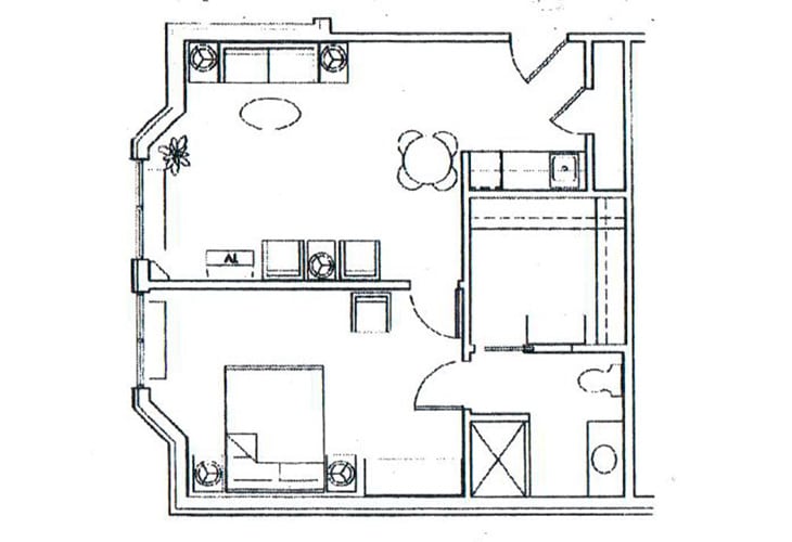 A floor plan of a small apartment, showing the arrangement of rooms and furniture.