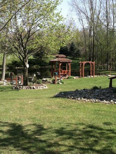 A serene garden setting featuring a gazebo and lush greenery.