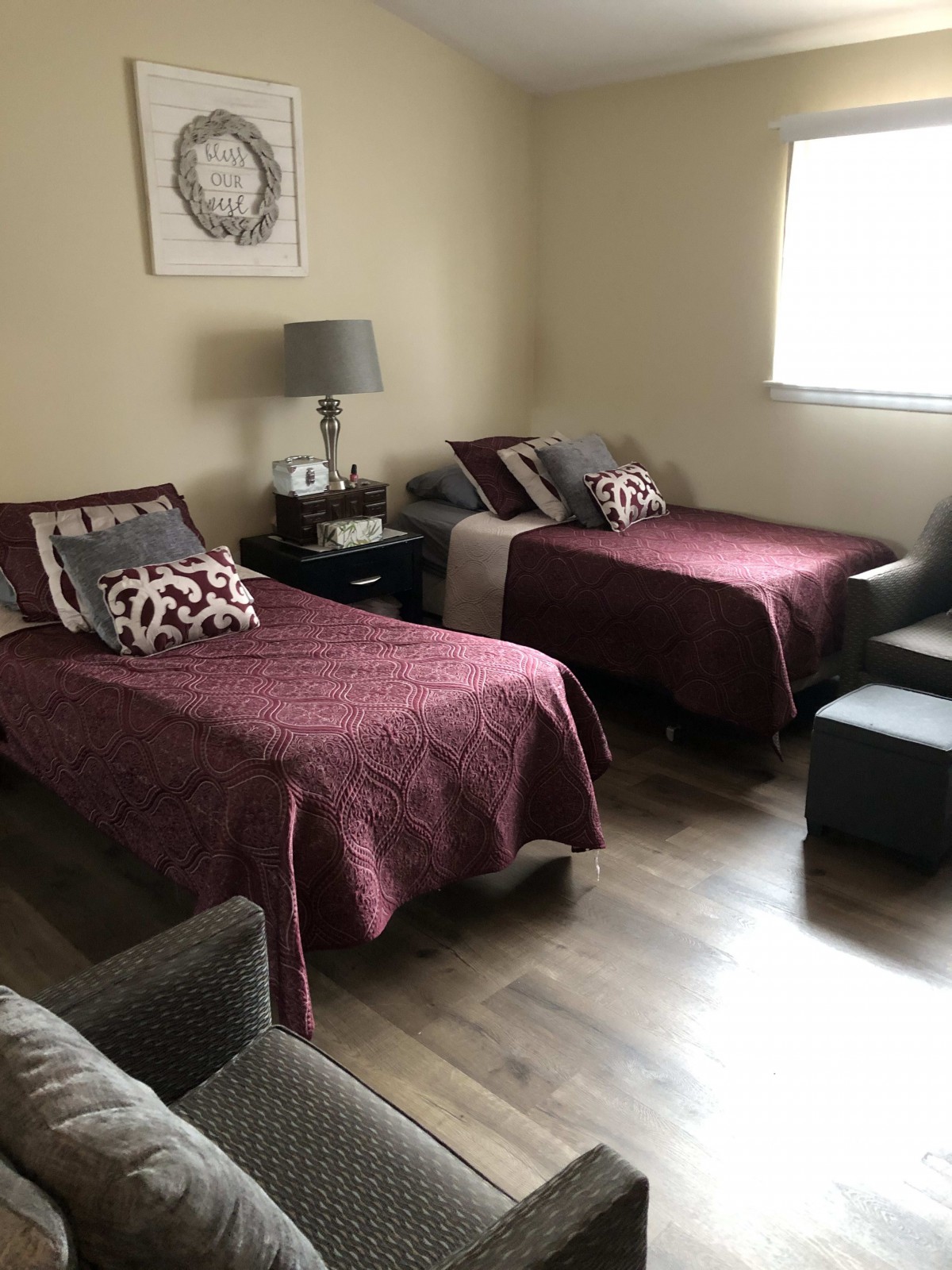 A cozy bedroom with two neatly made beds and stylish decor.