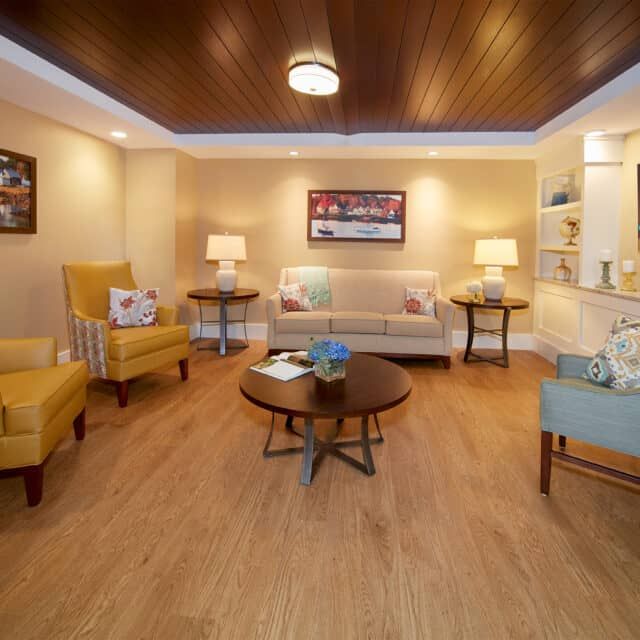 A cozy living room with stylish furniture and warm lighting.
