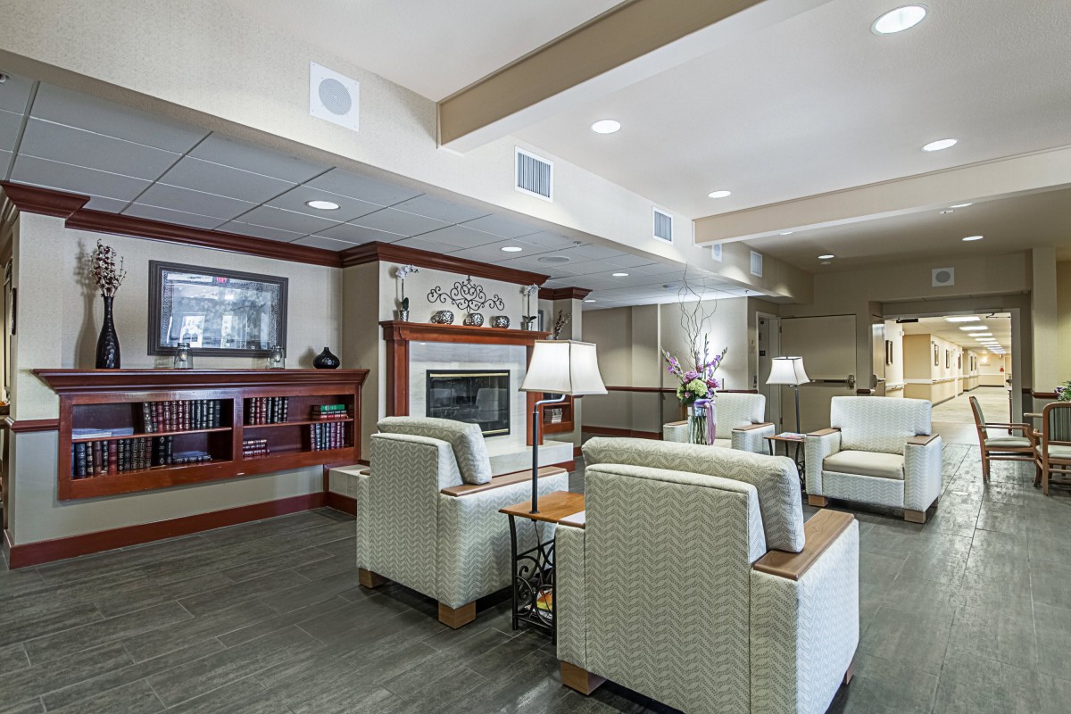 A cozy lounge area with comfortable seating and a fireplace.