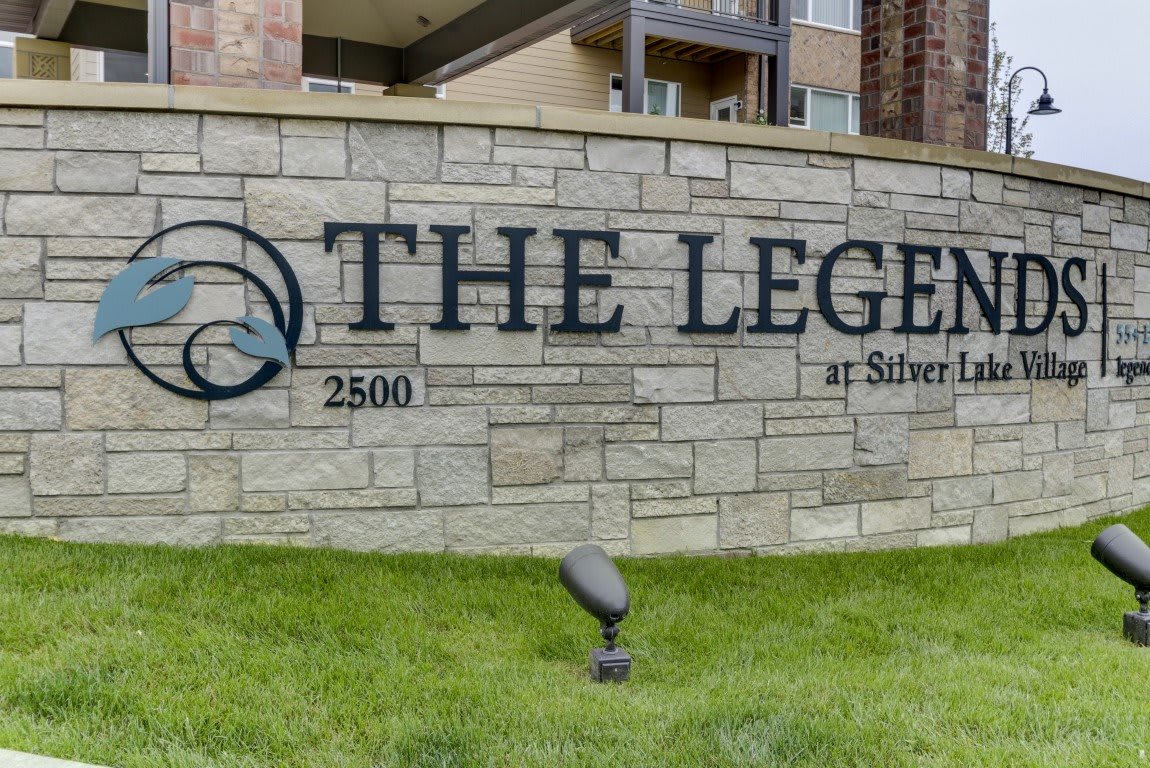 Entrance sign for The Legend apartment complex.