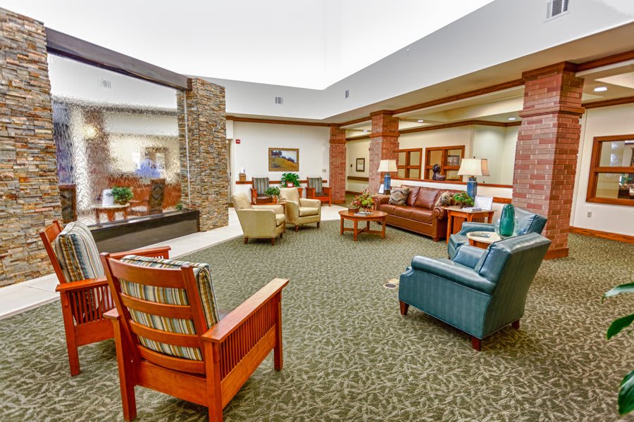 A spacious and well-decorated lobby featuring comfortable seating and elegant furnishings.