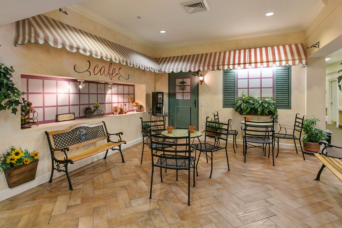 A cozy indoor cafe with stylish decor and seating arrangements.