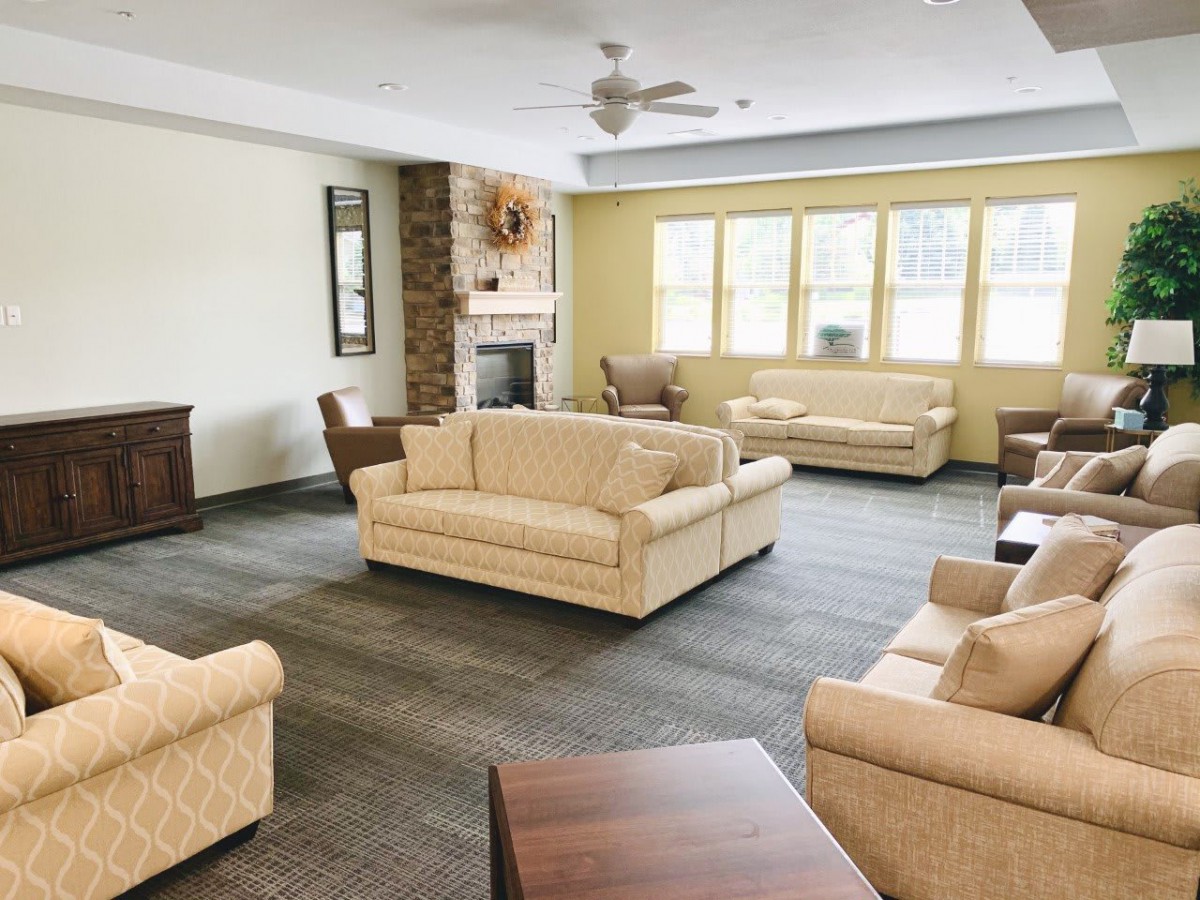 A cozy living room with comfortable sofas and a fireplace.
