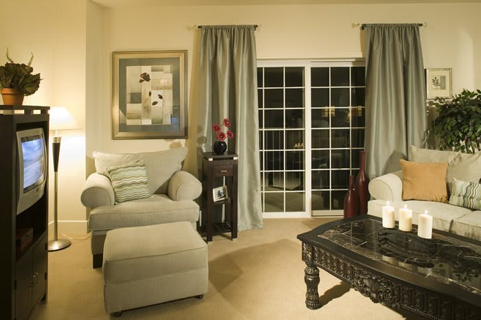 A cozy living room with comfortable seating and elegant decor.