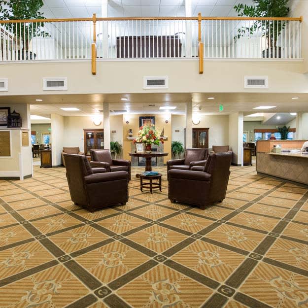 Spacious hotel lobby with comfortable seating and elegant decor.