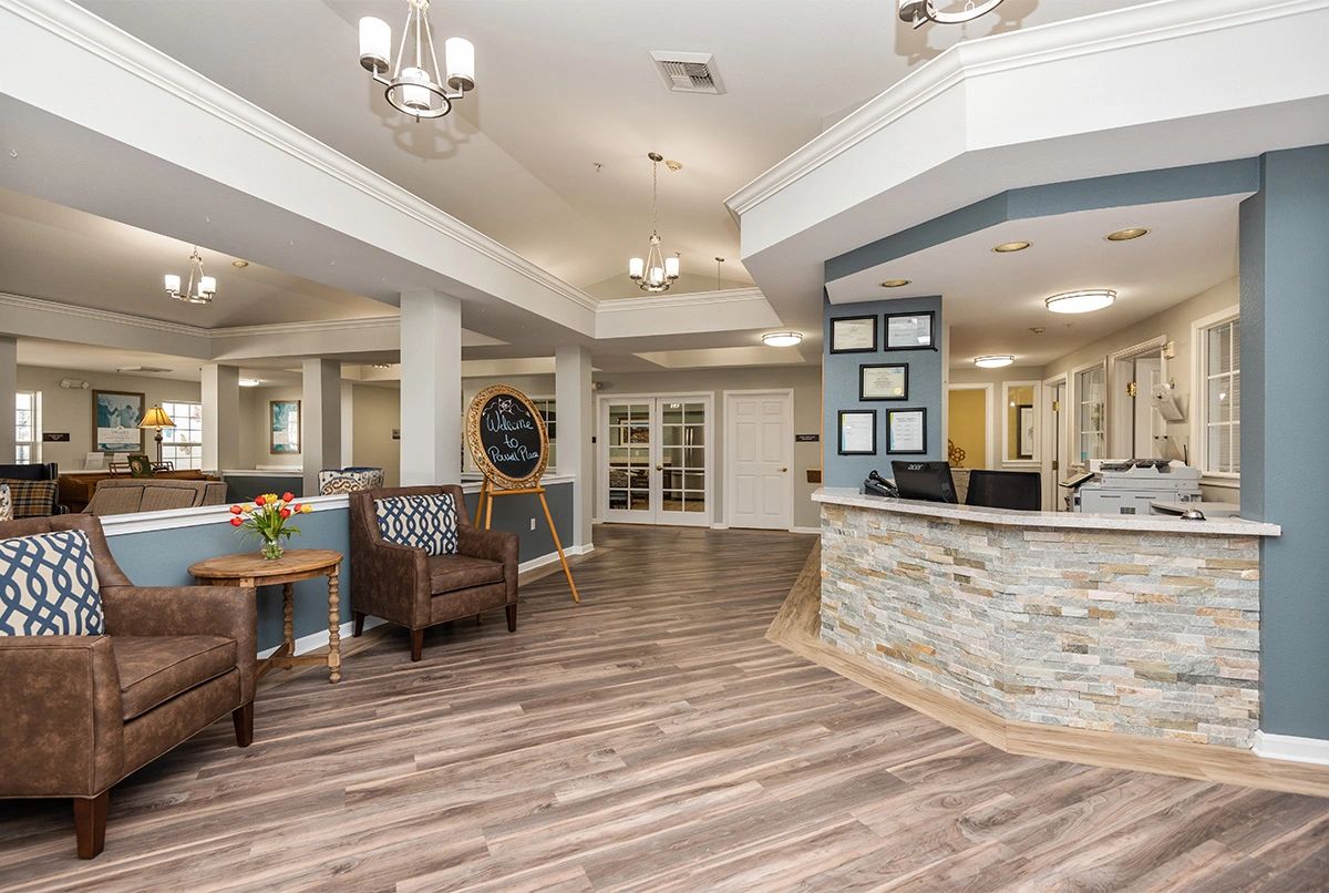 A modern reception area with stylish seating and decorative lighting.