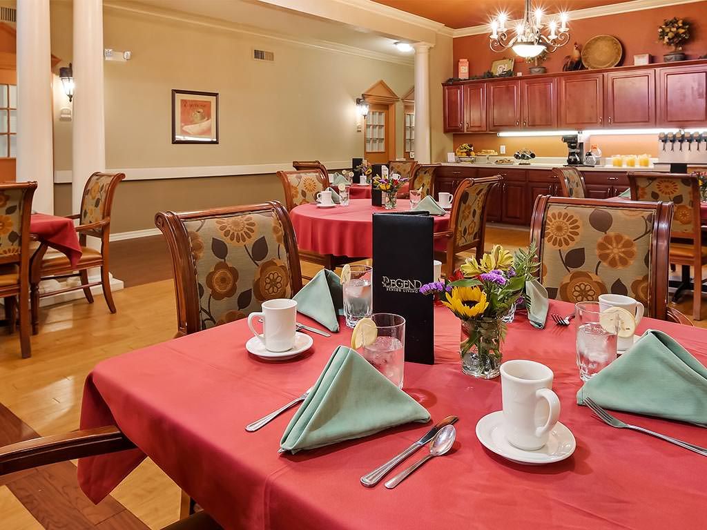 A neatly set dining table in an elegant restaurant setting.