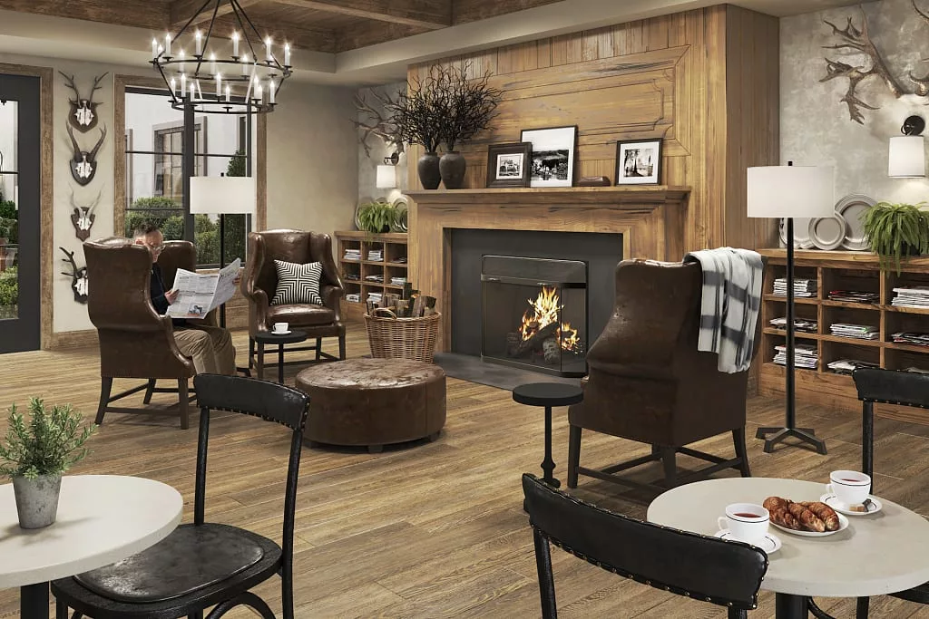 A cozy living room with a warm fireplace and comfortable seating.
