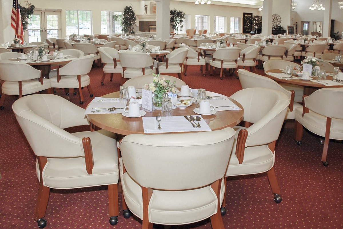 An elegant dining area with neatly arranged tables and comfortable seating.