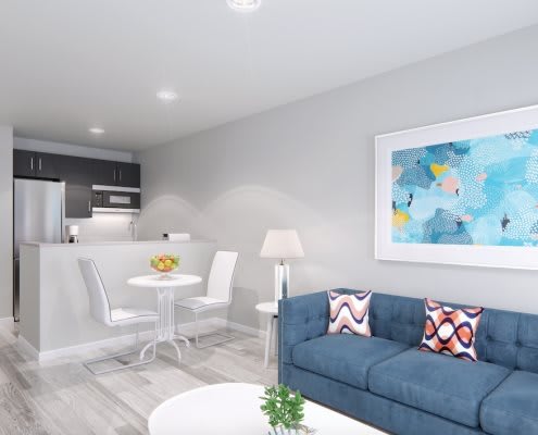 A modern living room with a cozy sofa, dining area, and contemporary artwork on the wall.