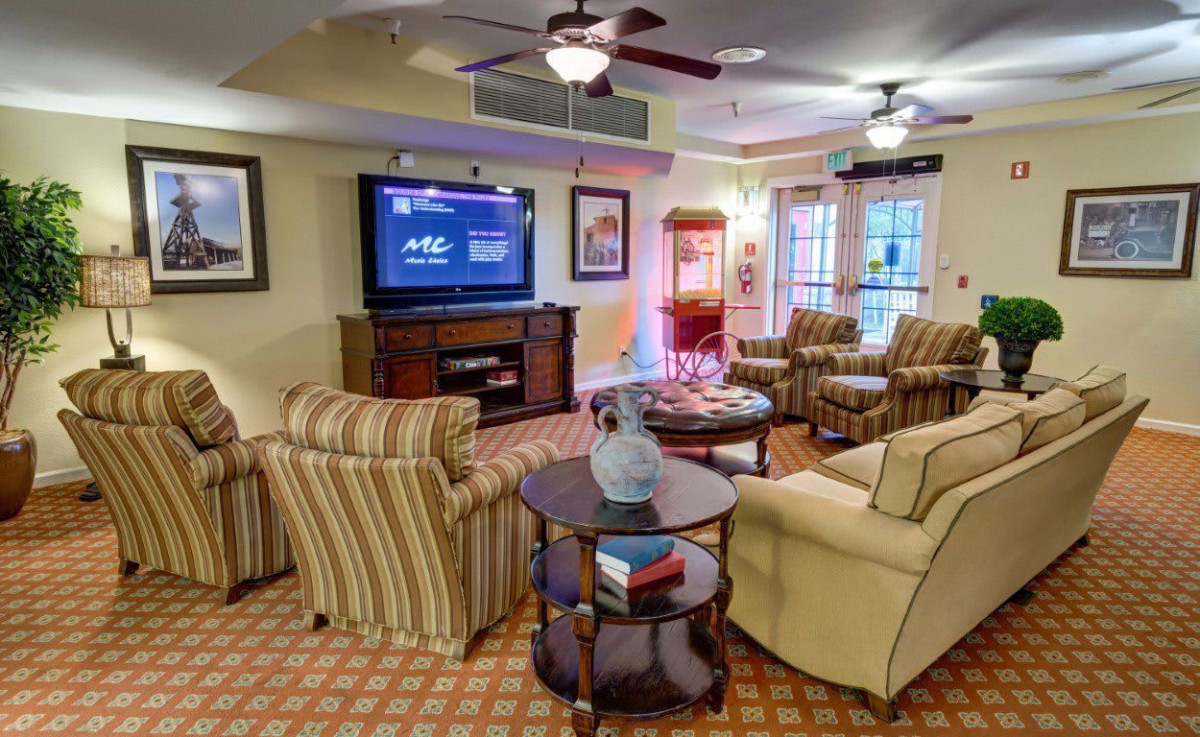 A cozy living room with comfortable seating, a television, and stylish decor.