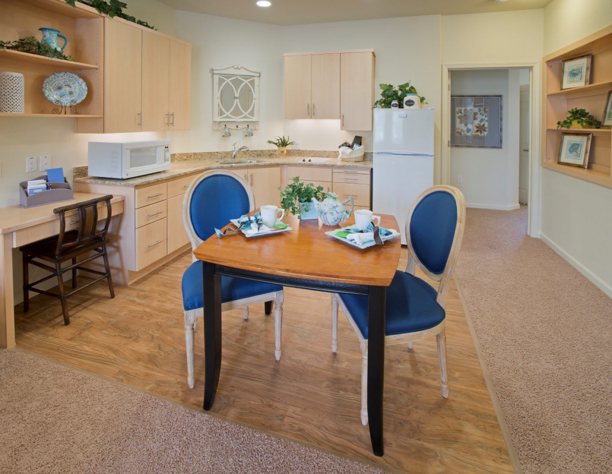A cozy kitchen and dining area with modern amenities and stylish decor.