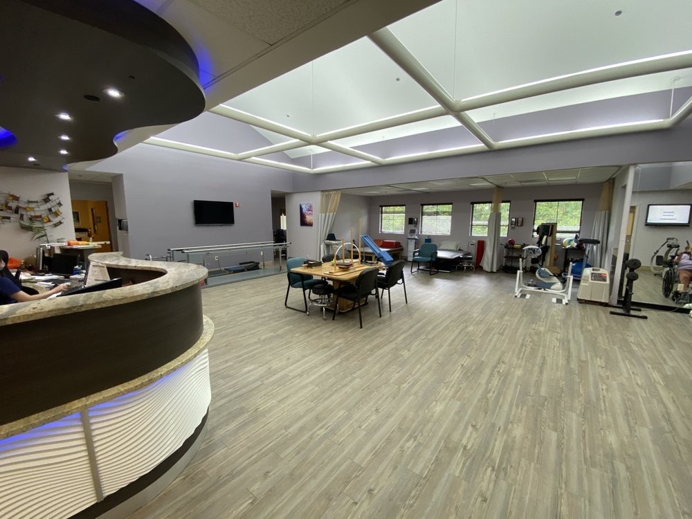 A modern office lobby with an open layout and contemporary furniture.