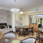 A cozy, modern living room with comfortable seating and a fireplace.