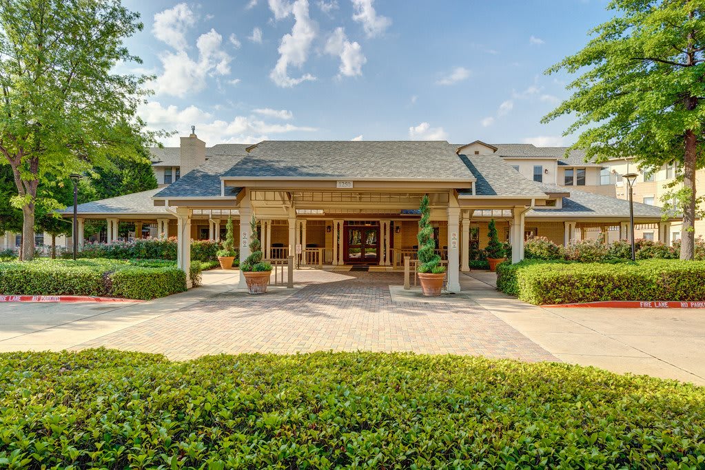 A beautiful residential house with a well-maintained entrance and landscaping.