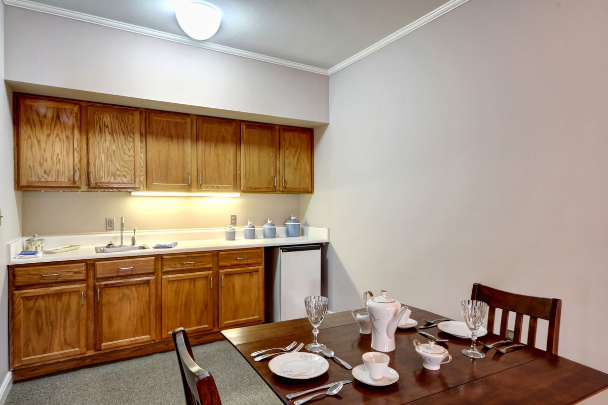 A cozy kitchen and dining area with a neatly set table.