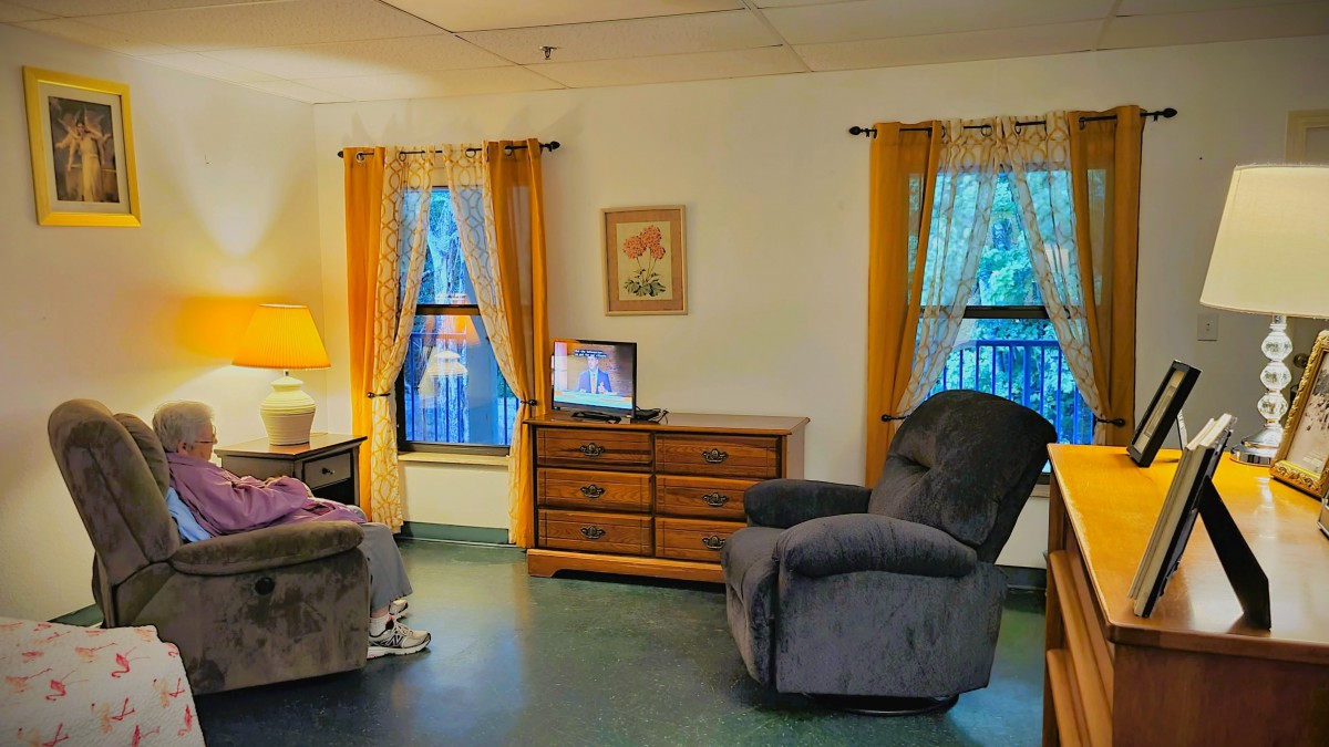 Cozy living room with warm lighting and comfortable furniture.
