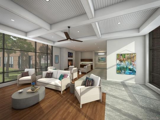 Modern living room with ample natural light and stylish decor.