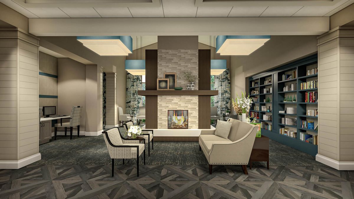 A modern living room featuring a cozy seating area around a stylish fireplace.