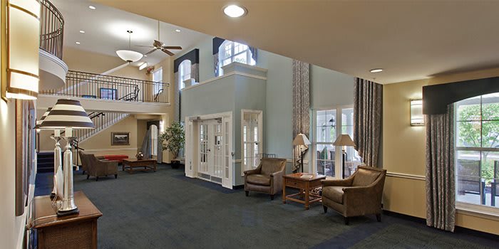Spacious lobby with comfortable seating and large windows.