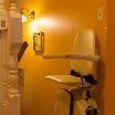 A stairlift installed on a staircase in a home for accessibility.