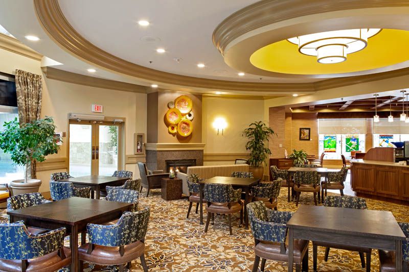 A modern dining area with elegant decor and ample seating.