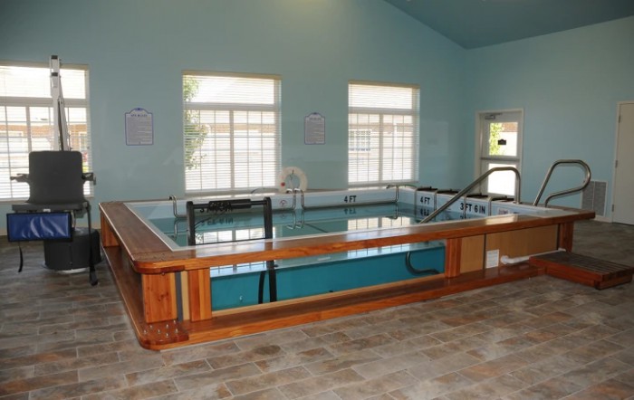 An indoor therapy pool designed for rehabilitation and water exercises.