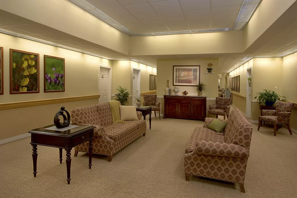 A well-decorated waiting room with comfortable seating and elegant decor.
