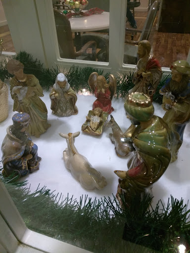 A beautifully arranged nativity scene featuring intricately designed figurines.