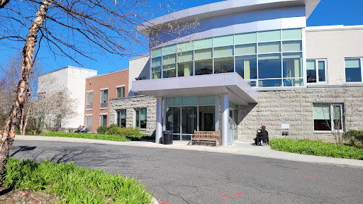 A modern building with large glass windows and a welcoming entrance.
