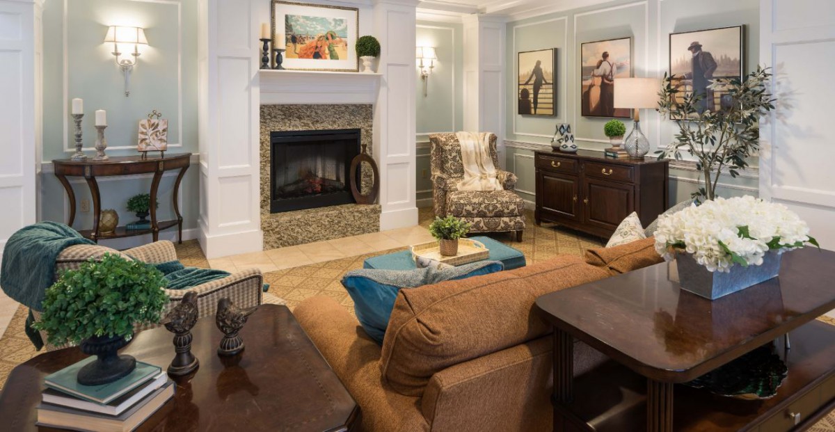 A cozy living room with a fireplace and stylish decor.