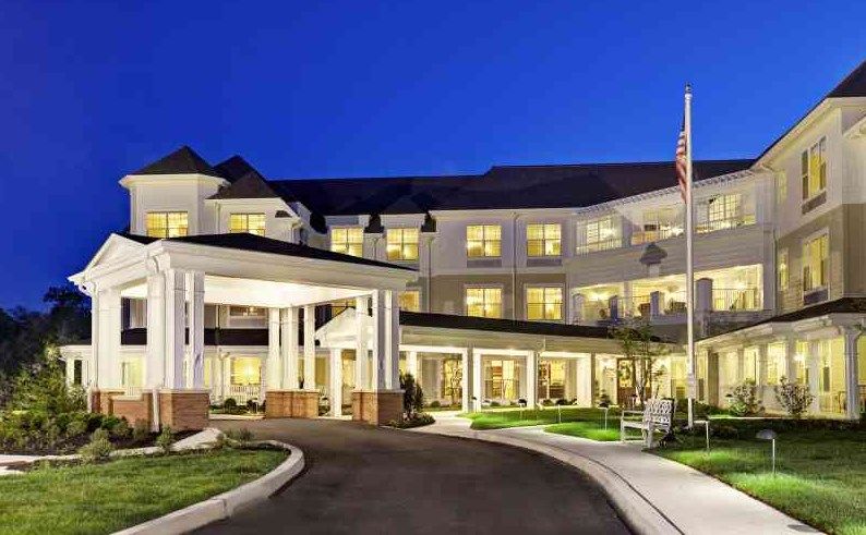 A well-lit hotel entrance at night.