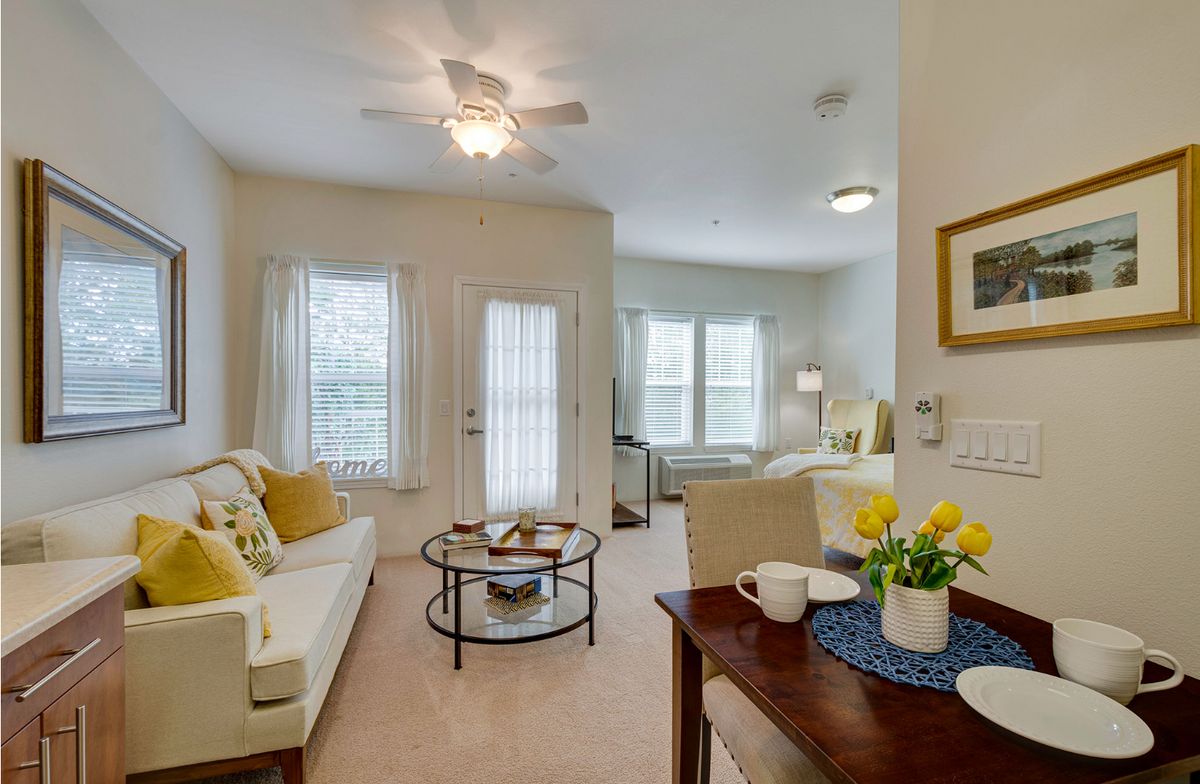 A cozy living room with comfortable seating and warm decor.