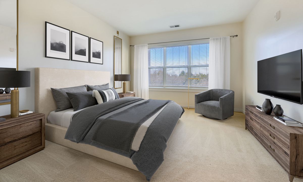 A modern and minimalist bedroom with neutral colors and natural light.