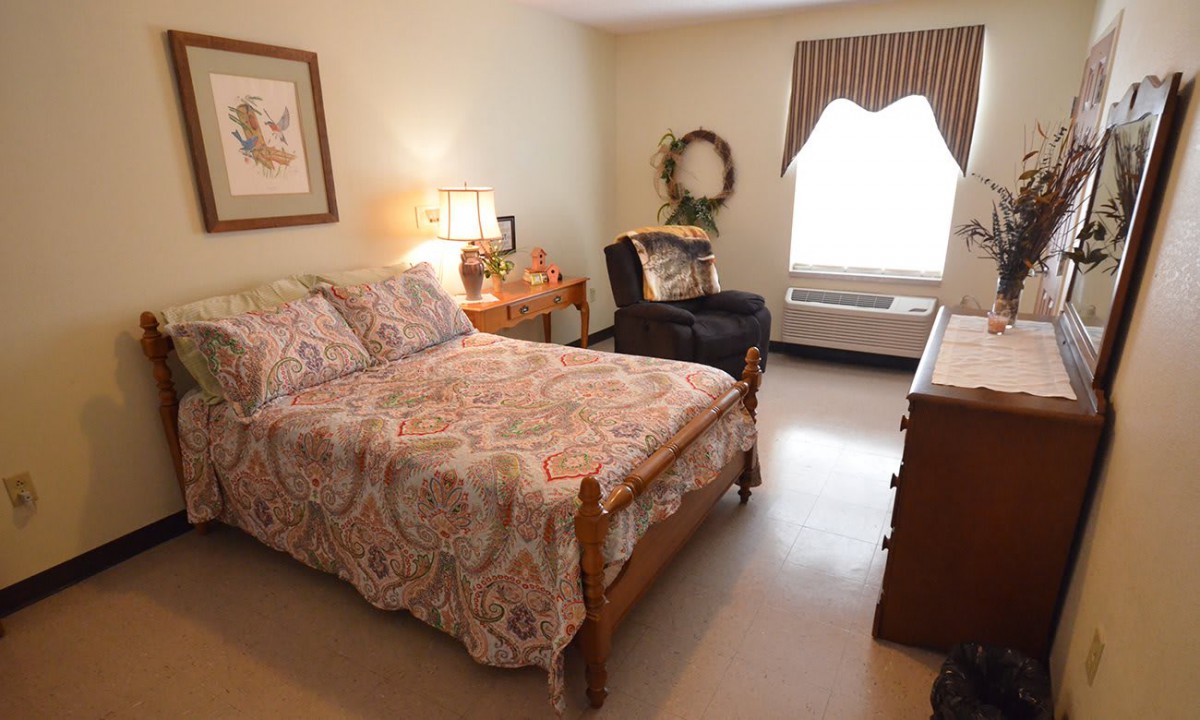 Cozy bedroom with a comfortable bed and elegant decor.