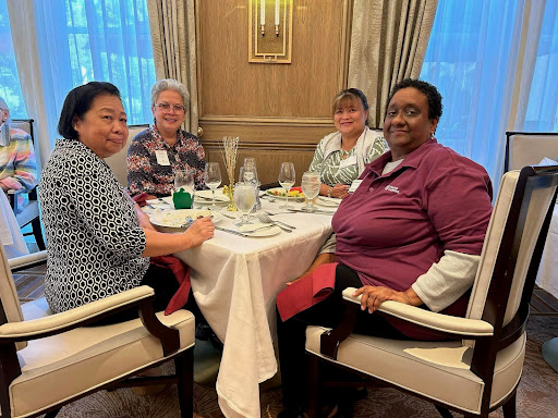 A group of friends enjoying a delightful meal together at a cozy restaurant.