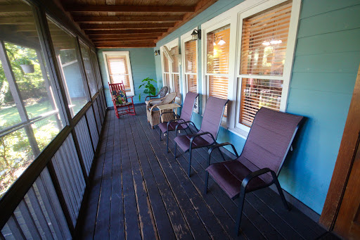 A cozy porch area with comfortable seating and a peaceful atmosphere.