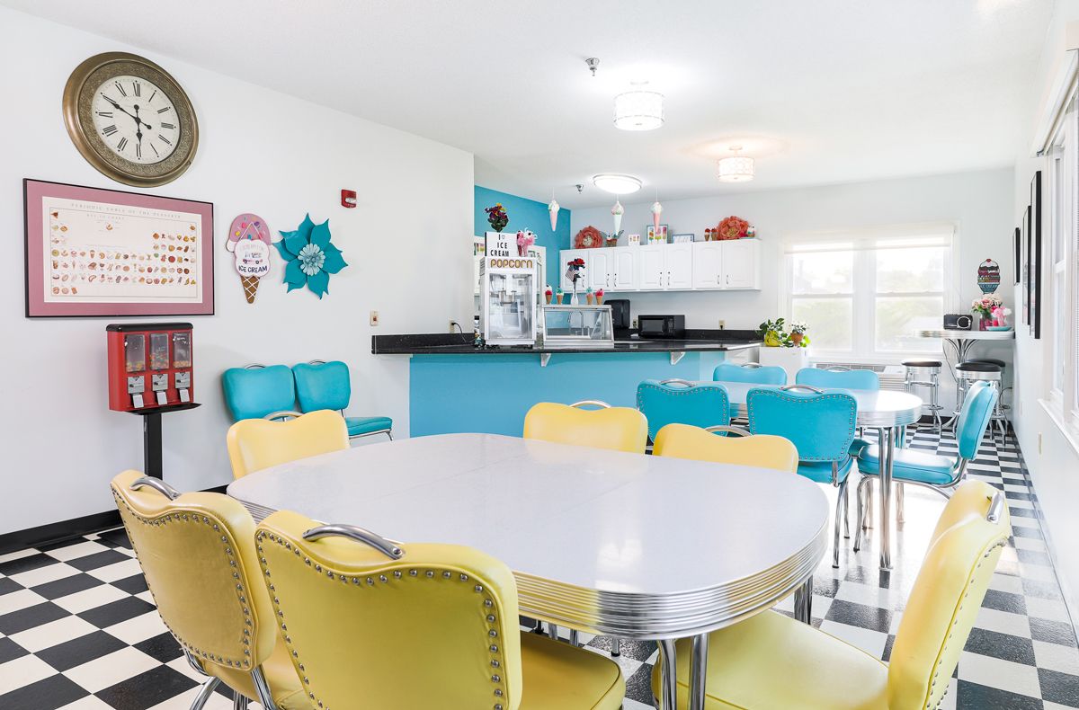 A vibrant retro-style diner with colorful seating and vintage decor.