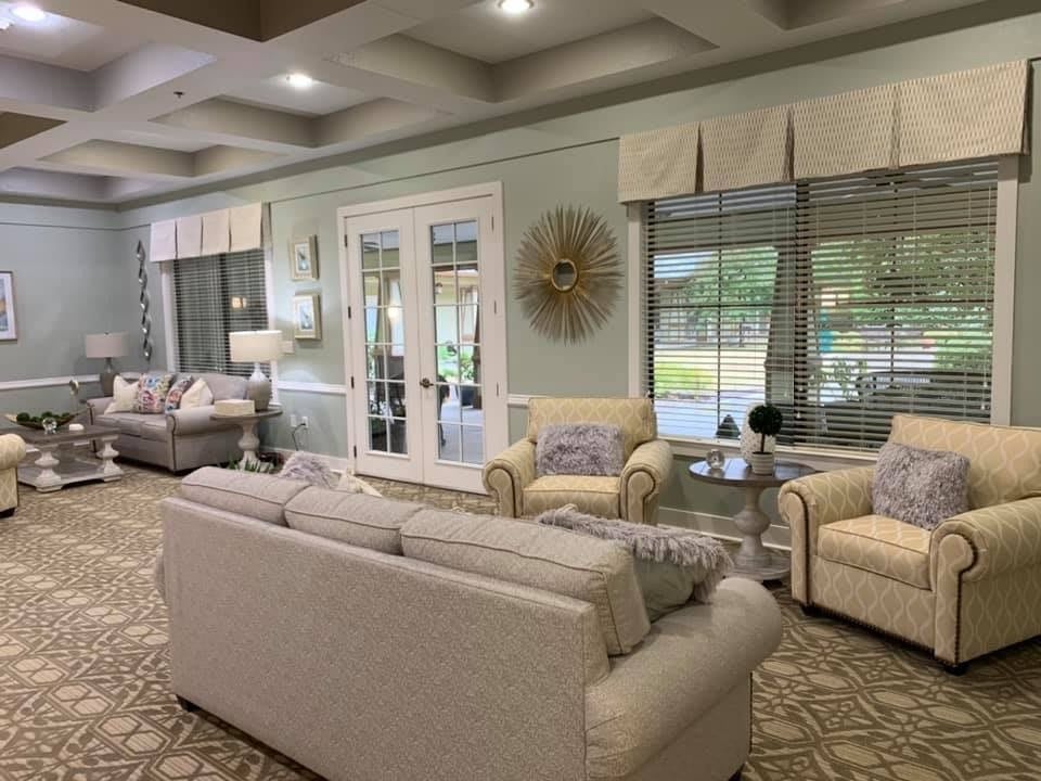 Bright and spacious living room with comfortable sofas and large windows.