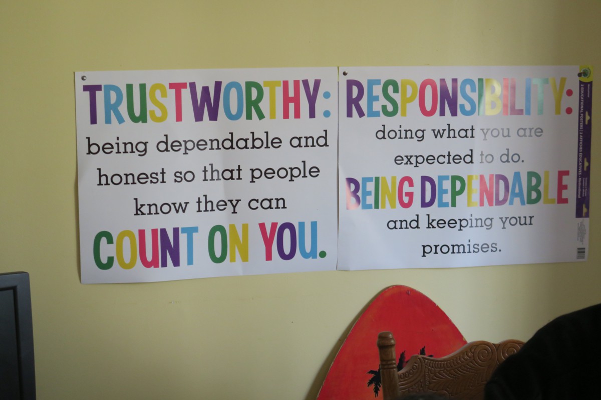 Classroom wall with motivational posters about being trustworthy and responsible.