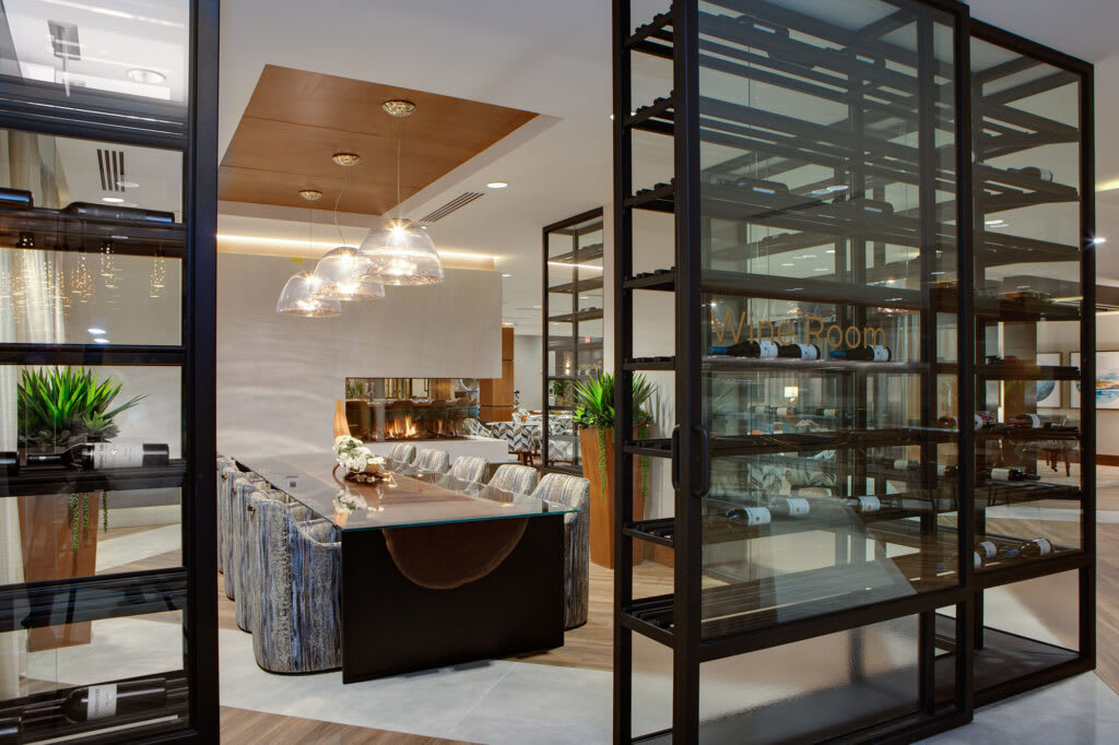 A modern living room with elegant furniture and open shelving.