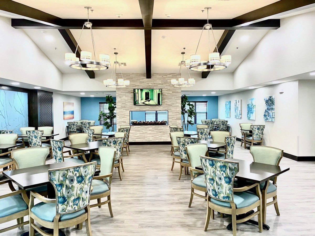 A modern dining area with elegant decor and ample seating.