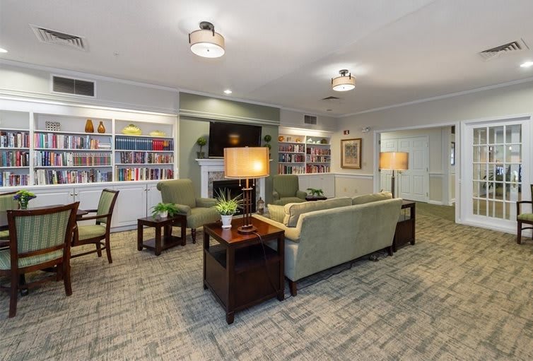 A cozy living room with comfortable seating and decorative elements.
