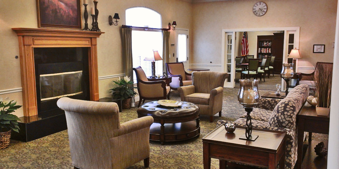A cozy living room with comfortable seating and a fireplace.