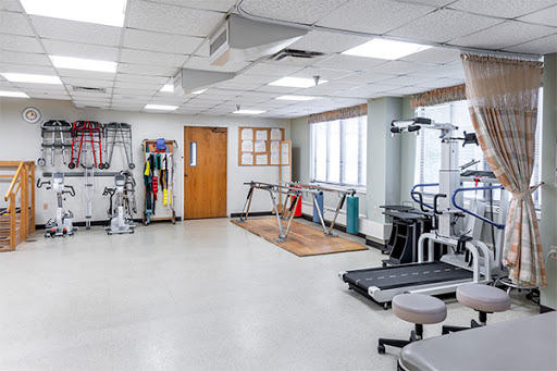 A well-equipped gym space designed for fitness and rehabilitation activities.