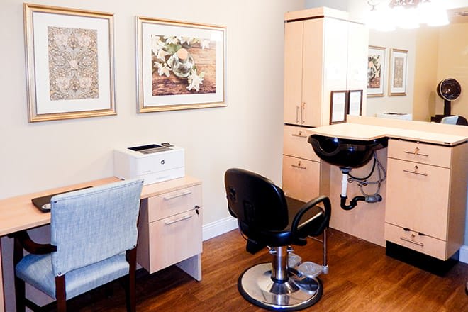 A well-organized salon interior with chairs and beauty equipment.