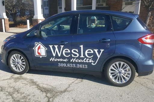 A vehicle featuring the branding of Wesley Home Health, indicating its role in healthcare services.
