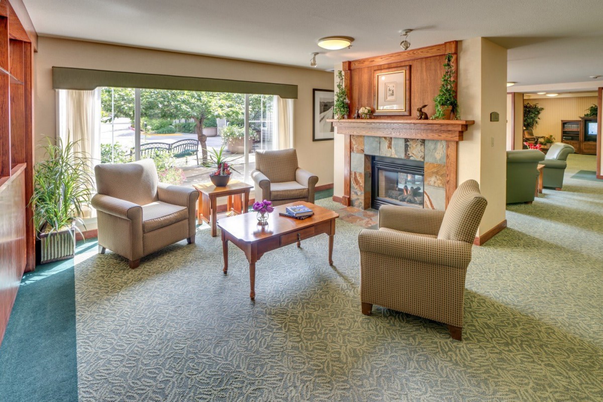 Cozy living room with a fireplace and comfortable seating area.